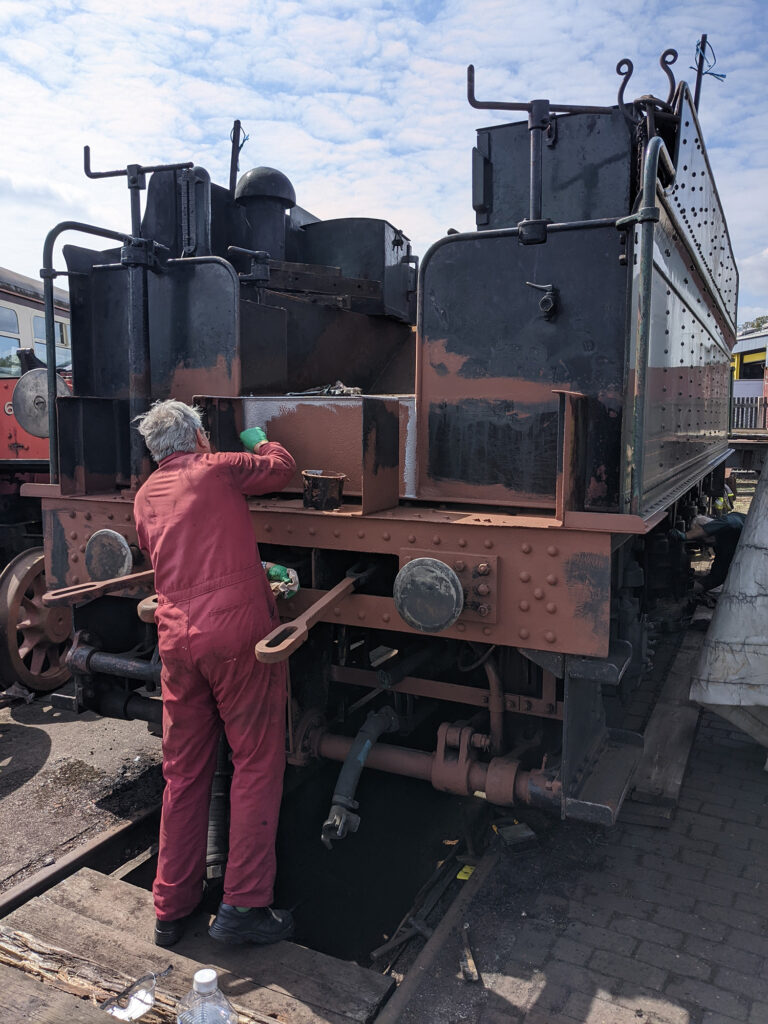 Meanwhile at the leading end of the tender, EMF volunteer Andrew Boucher was starting on the repaint below the coal space on 26th April [Photo: Adrian Hassell]