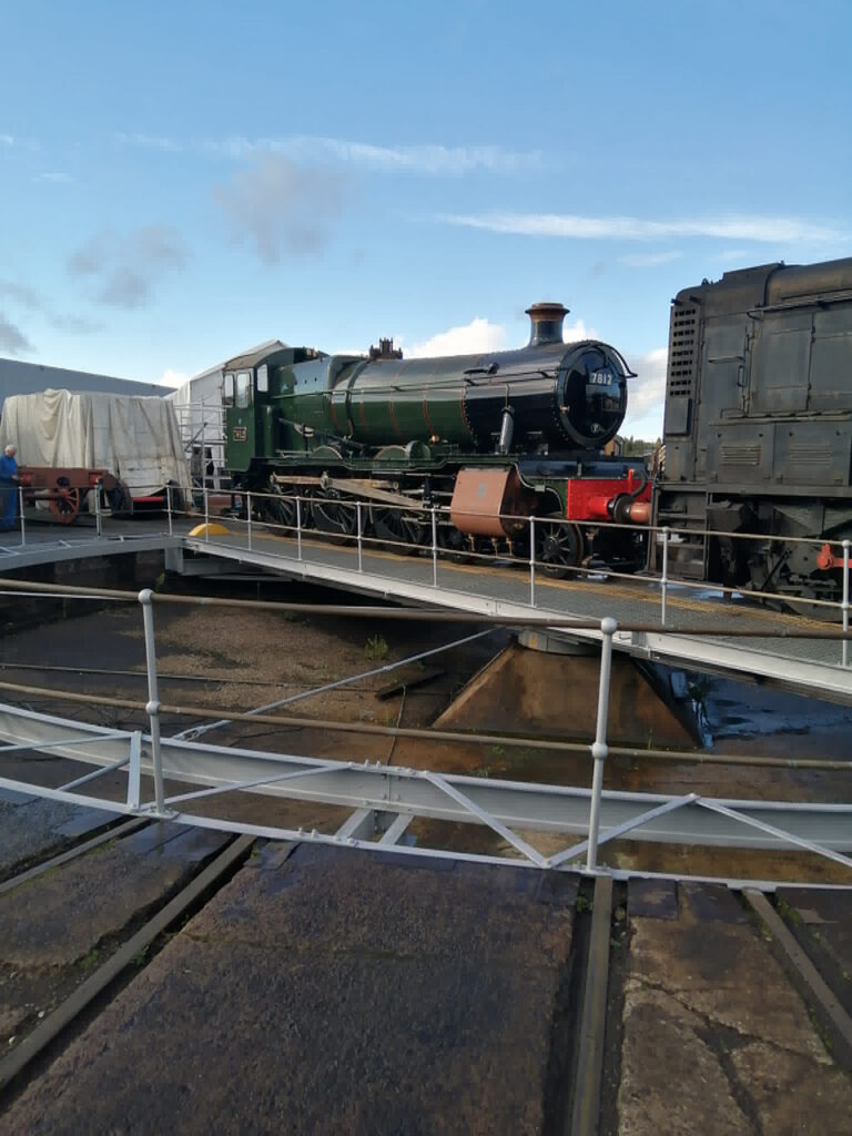 7812 seen on the turntable at Tyseley on 7th October after emerging from Works for the first time since 2019, whilst being shunted to the EMF’s covered siding to be united with 3,500 gallon tender T2334 and to allow final completion activities to proceed [Photo: Terry Jenkins]: