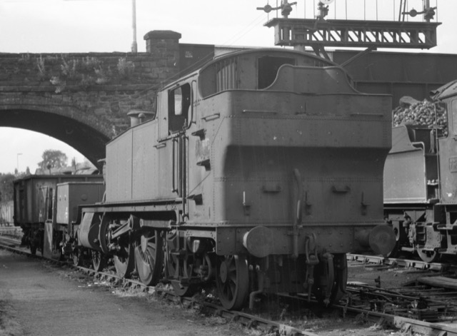 5164 seen at Pontypool Road on 18th August 1963 following withdrawal with a slipped tyre, but prior to its transfer to Woodhams scrapyard at Barry