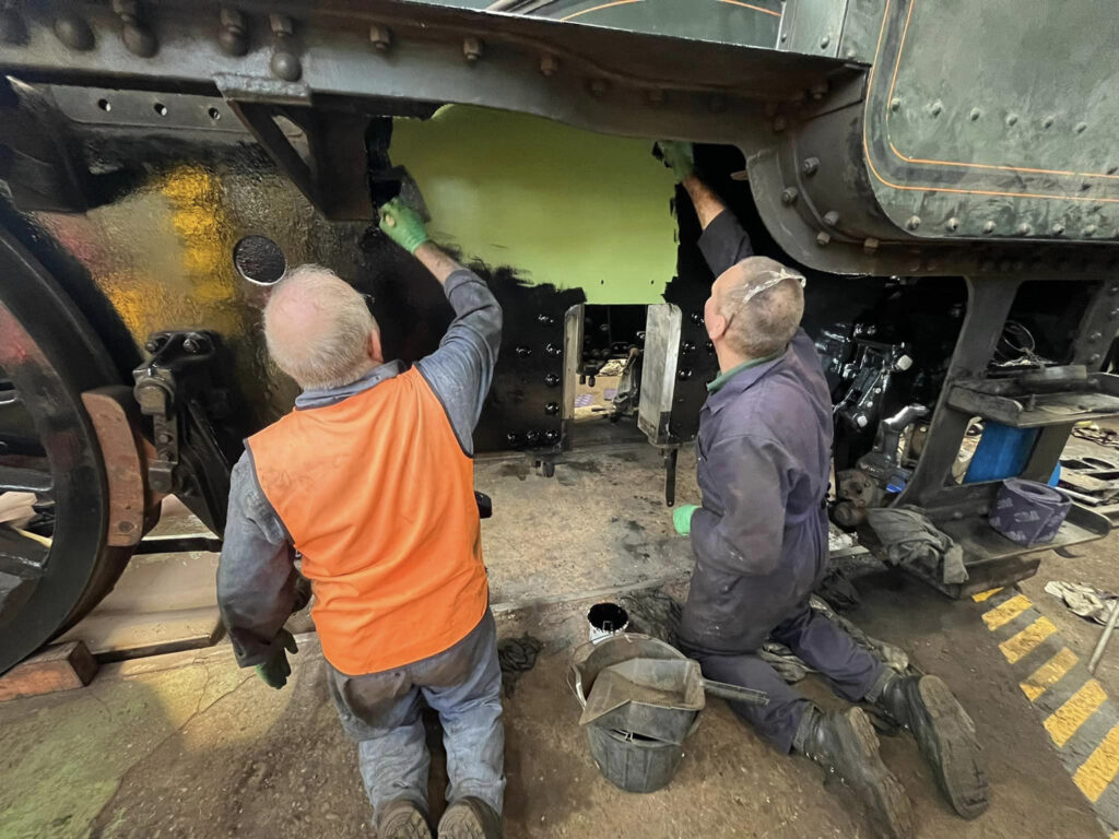 Also on 14th June, Paul Spence and Adrian Hassell undercoat 7802’s frames behind where the trailing coupled wheels will sit. Photo: Jane Preece